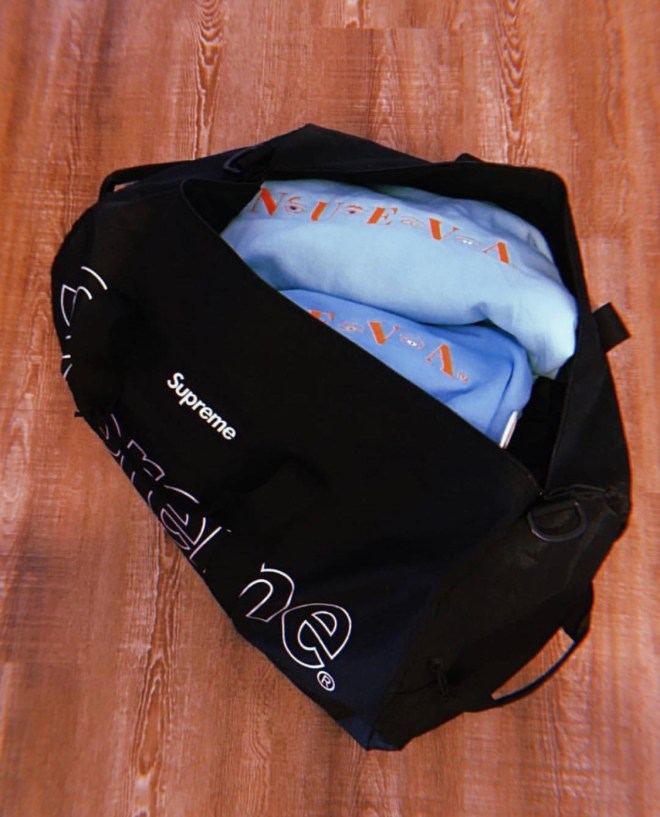 NUEVA hoodie in a Supreme duffle bag