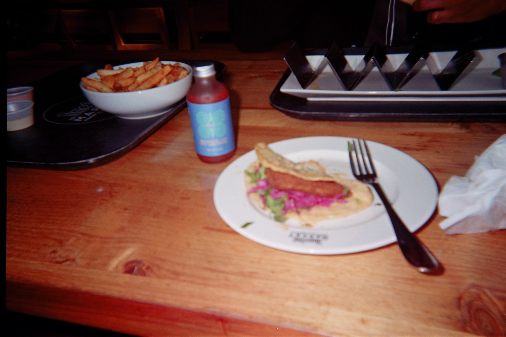 Gavi sauce pictured next to a fish taco in Time Out Market - Fulton Square on 35mm